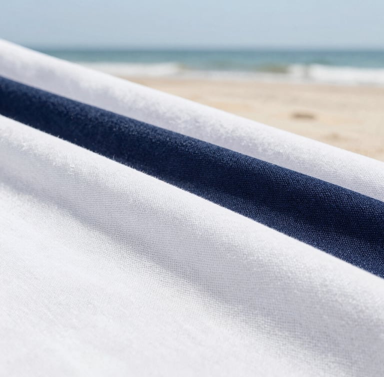 Close-up macro shot of pristine, high-end linen fabric texture, soft natural coastal daylight, clean white and deep navy tones, sharp focus, 35mm