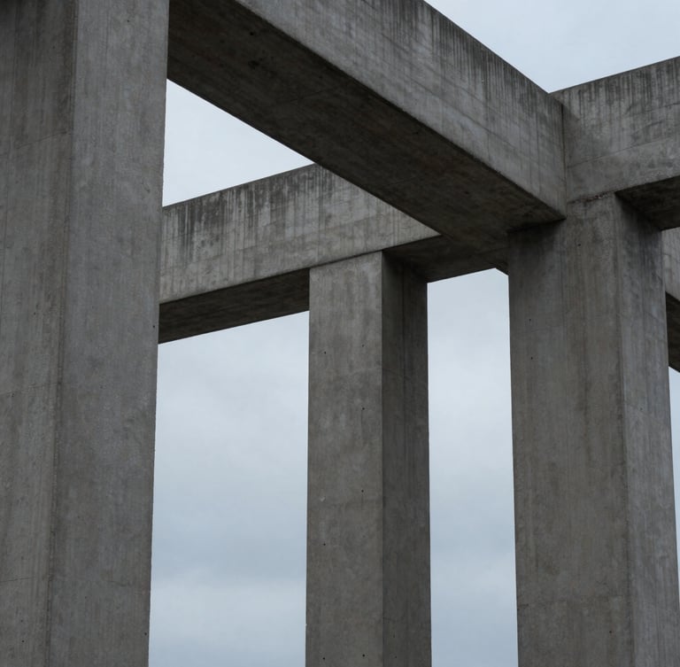 Tight, abstract structural crop of modern architectural concrete columns meeting under a diffused, cool overcast sky, emphasizing structural integrity and geometric precision.