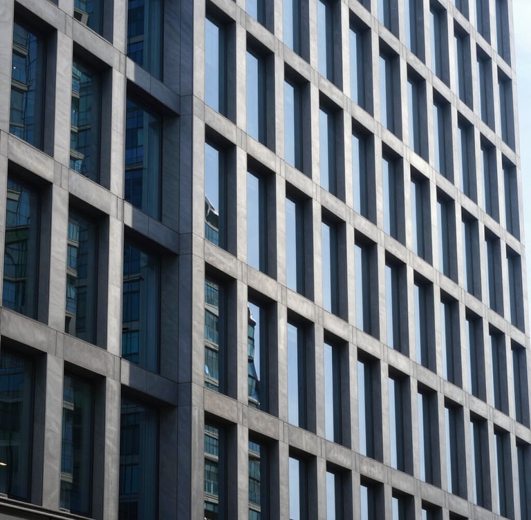 Crisp architectural photography of a modern high-end corporate office facade with clean structural lines, cool daylight, deep blue glass reflections, 35mm editorial style