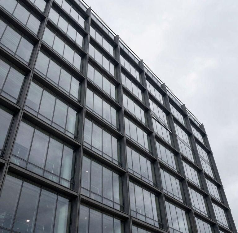 Wide architectural shot of a modern glass office building facade in Warsaw under an overcast sky, clean technical lines, geometric steel structures.