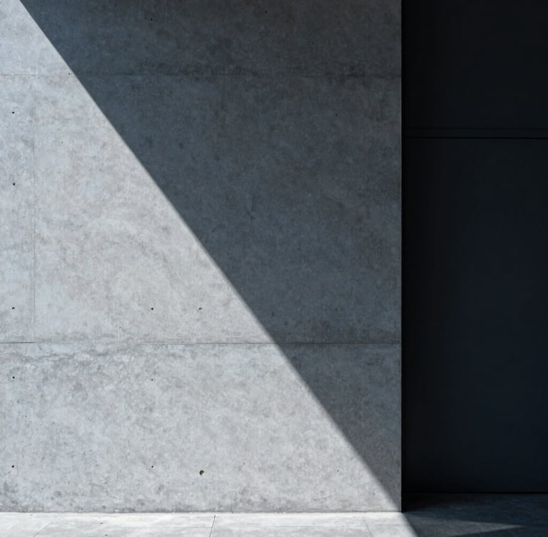 Sleek corporate photography, cool architectural daylight, sharp geometric shadows on a concrete wall, 35mm, minimalist slate tones.