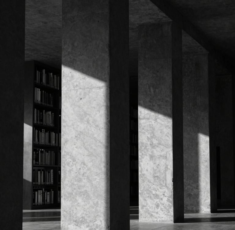 Stark architectural detail of a modern library, concrete pillars casting deep linear shadows, high-contrast black and white photography, moody natural light.