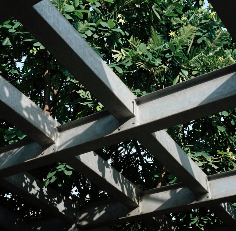Low-angle architectural crop of interlocking steel and concrete beams under sharp daylight, deep forest green shadows, high contrast, 35mm lens