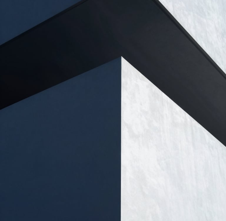 A minimalist editorial portrait of a founder in a modern architectural setting, shot from a low angle with cool crisp daylight, deep navy shadows, and clean geometric lines, 35mm lens.
