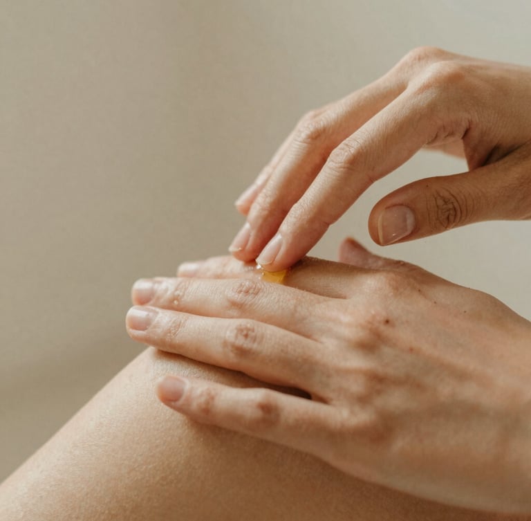 Close-up portrait shot of hands gently applying botanical oils on clean skin, soft diffused warm daylight, natural textures, shallow depth of field.