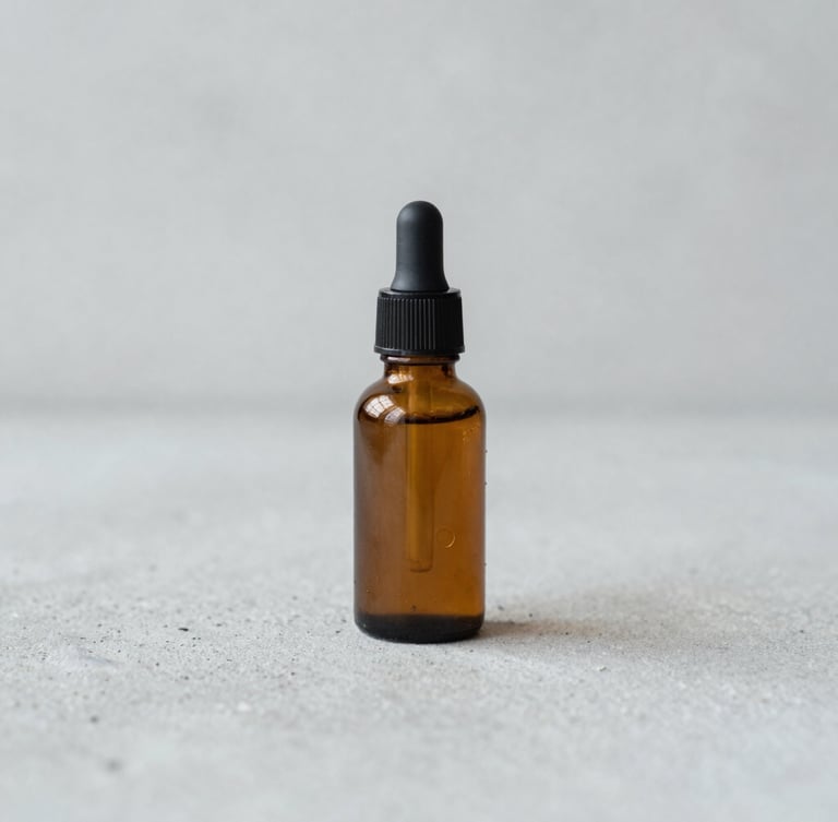 Straight-on eye-level portrait of a minimal amber serum bottle on a raw light grey concrete surface, soft diffused daylight, macro depth of field, 35mm