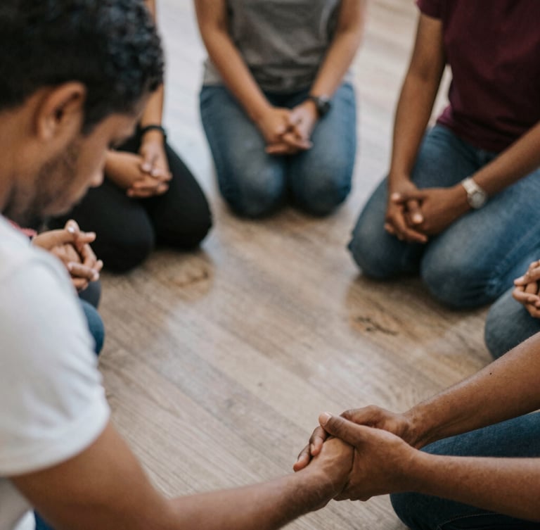 Wide panoramic style portrait of two pastors in deep conversation, warm natural light filtering through high windows, focus on their hands holding a bible, solemn and prestigious editorial atmosphere.
