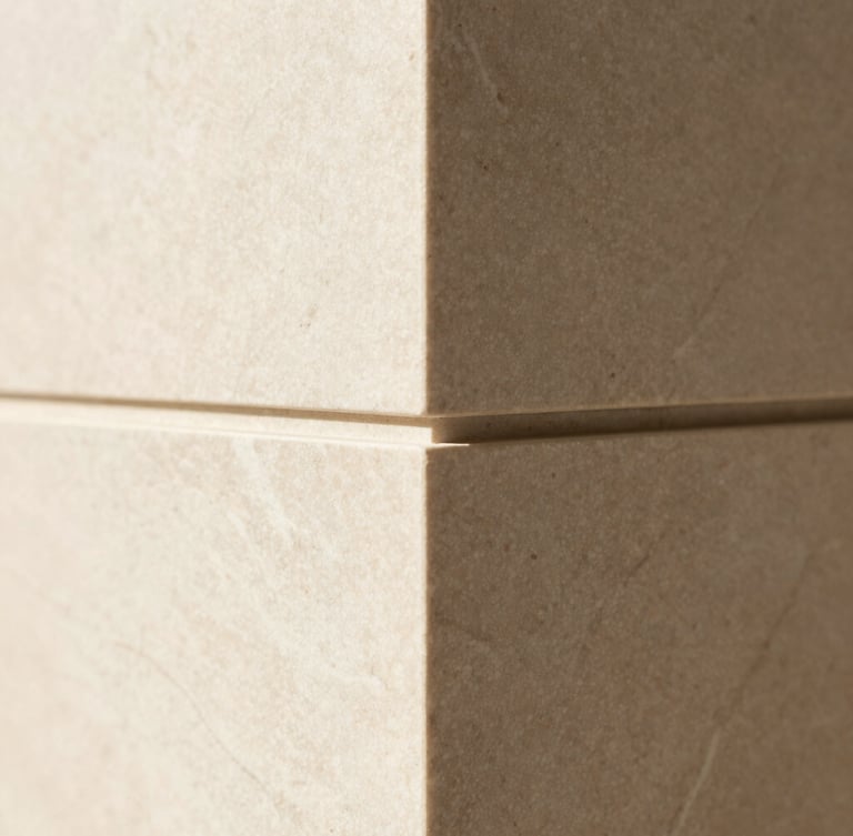 Close-up macro shot of premium custom millwork joints, natural stone veining, soft diffused daylight, warm architectural minimalism, 35mm