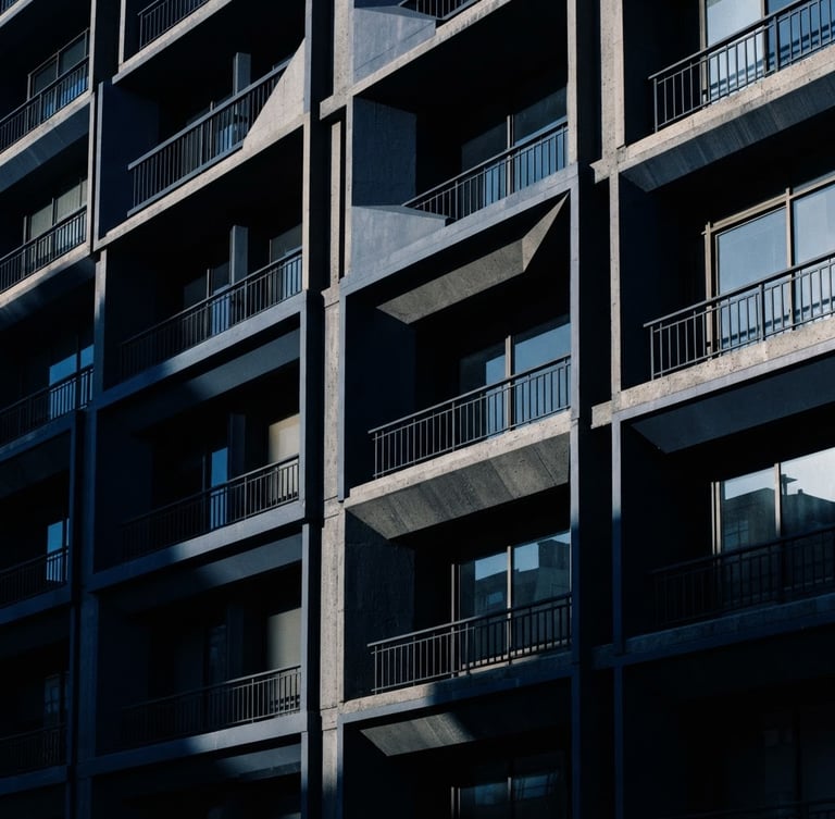Architectural detail of the Colombian Supreme Court building facade in Bogotá, high-contrast morning light, deep geometric shadows, navy tones, 35mm lens