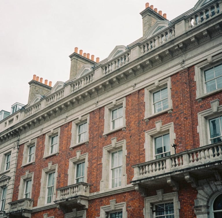 Architectural crop of Georgian brickwork and stone cornices in Hanover Square, desaturated cool tones, soft overcast London daylight, 35mm film.