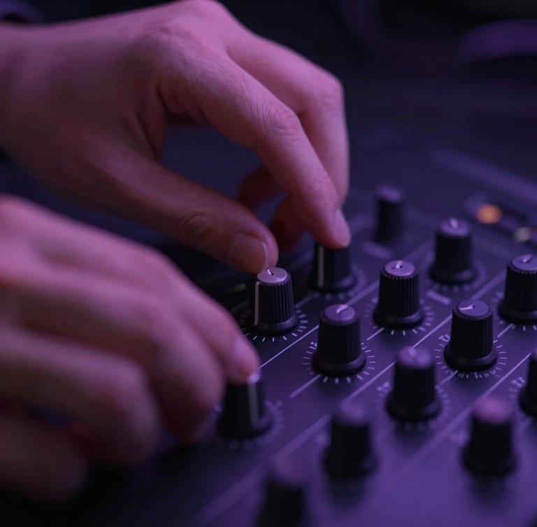 Macro close-up of hands adjusting physical knobs on a premium hardware controller in low-key moody studio lighting with soft purple neon glow, shallow depth of field