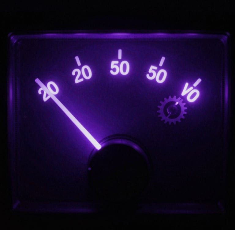 Tight macro shot of glowing VU meter needle bouncing in a dark studio, neon violet backlighting, moody shadows, cinematic.