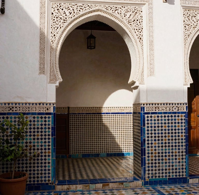 Warm editorial photography of a traditional Andalusian courtyard in Tetouan, intricate mosaic tilework, soft Moroccan sunlight filtering through an archway, 35mm