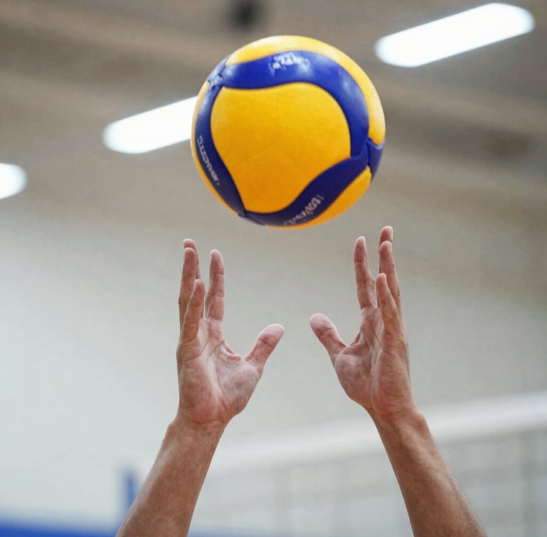 A close-up action shot of a player's hands forming a perfect passing platform, contacting a volleyball, bright indoor gym lighting, dynamic low angle, crisp athletic focus.