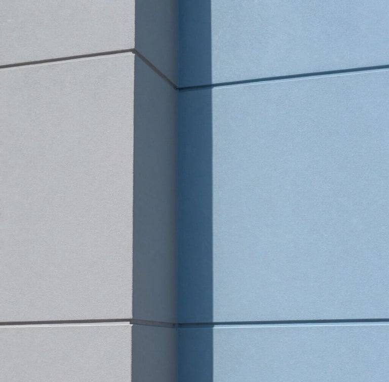 Close-up portrait of a perfectly masked interior corner, crisp architectural photography, bright natural daylight, clean blue and gray tones, sharp focus, 35mm