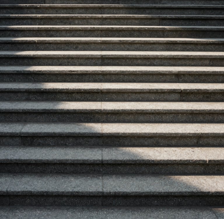 Soft indirect daylight casting long shadows across textured stone steps, minimalist architectural lines, calm and structured composition.