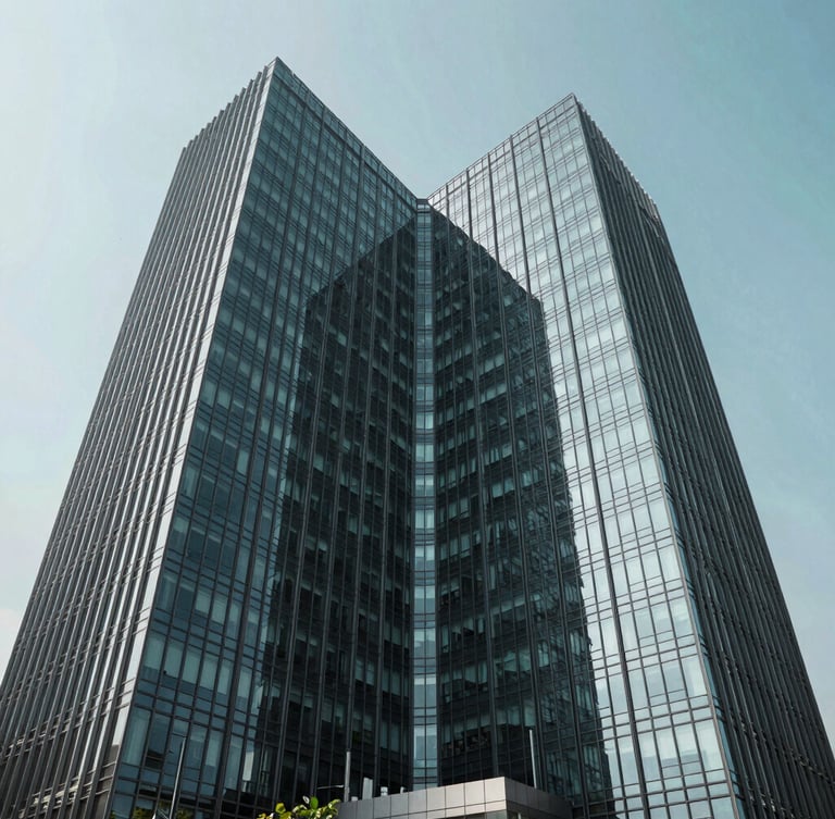 Symmetrical wide-angle architectural shot of a modern glass office tower in IT City Mohali, bright daylight, cool charcoal and teal tones, sharp focus