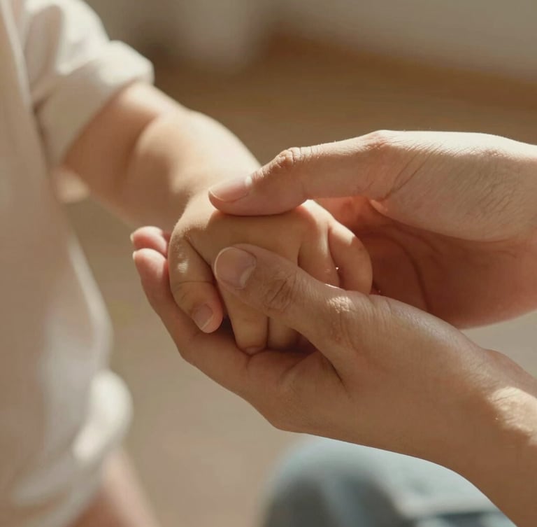 Close-up of a mother gently holding her child's hand, warm morning sunlight, natural textures, soft focus, intimate and emotional atmosphere