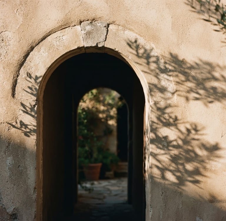 Architectural close-up of a warm stucco archway in soft Mediterranean sunlight, casting long elegant shadows, minimalist aesthetic, 35mm photography