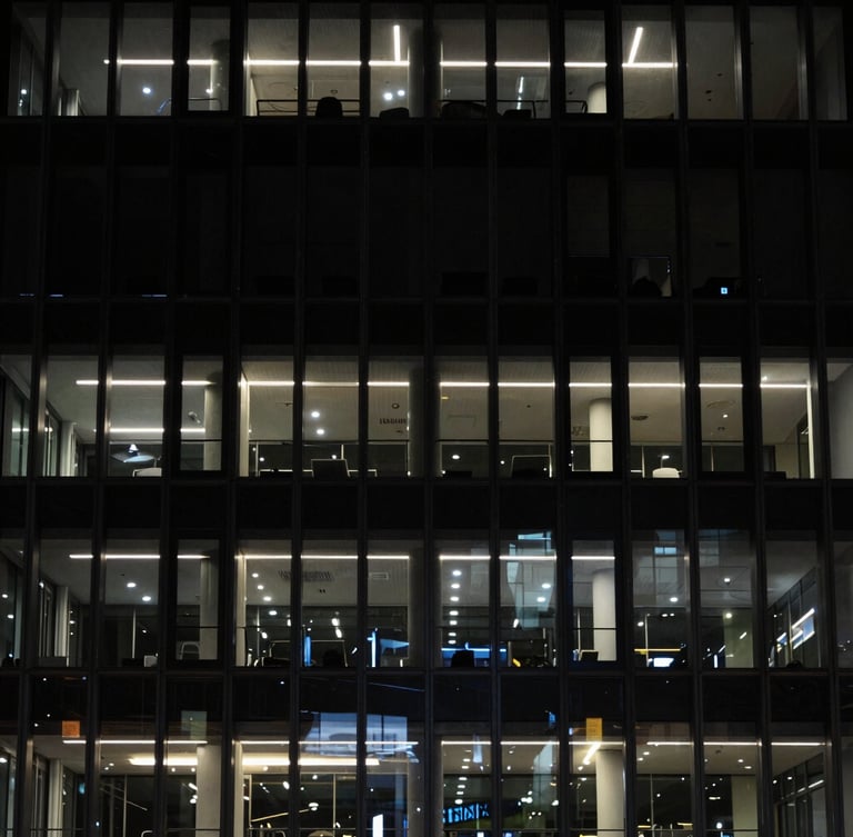 Architectural detail of a modern, secure office building facade at night, low-key dramatic lighting, sharp focus, dark tones, 35mm