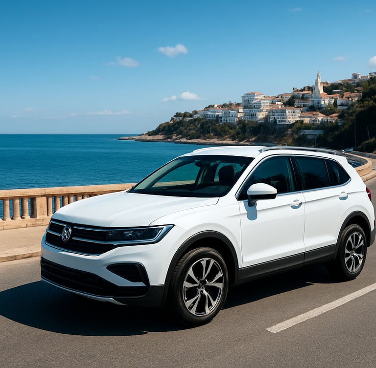 A clean modern white SUV parked along the scenic Mediterranean coastal road in Algiers, bright daylight, high-contrast clean tones, wide-angle lens
