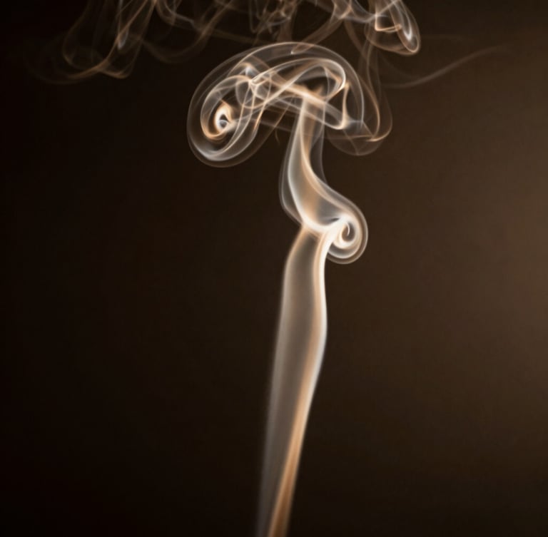 Elegant silhouette of rising smoke curls against a dark, low-key background with warm golden undertones, dramatic side-lighting.