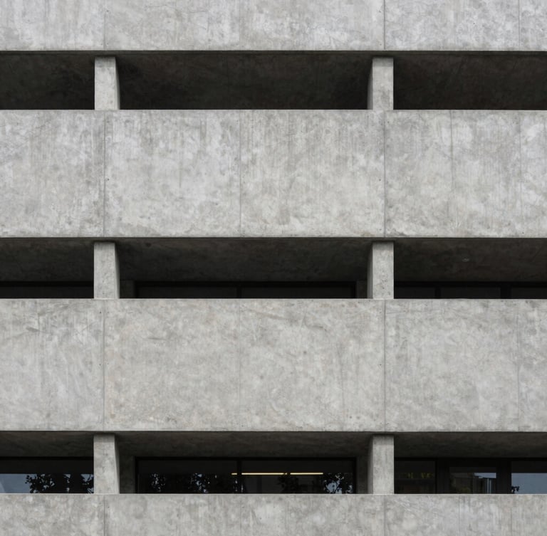 Straight-on architectural photograph of a modern Swiss concrete building facade, crisp geometric lines, soft diffused daylight, elegant and minimal.