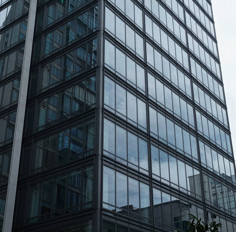 Wide architectural angle of a modern glass facade in São Paulo, cool diffused daylight, deep blue and slate gray tones, editorial corporate photography