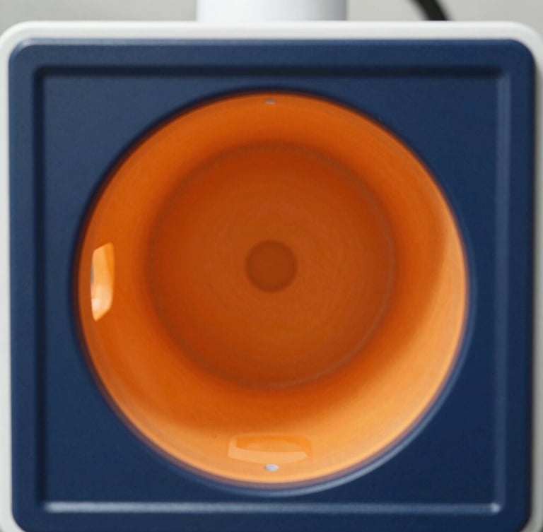 Macro shot of a high-tech diagnostic screen displaying a perfectly clean and clear pipe interior, bright daylight, high-contrast navy and orange tones