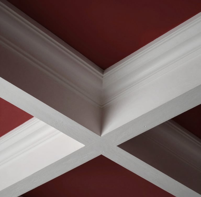 Close-up architectural detail of a coffered ceiling joint, showing flawless trim carpentry integration, crisp white paint, dramatic raking light, sharp focus, premium architectural photography.