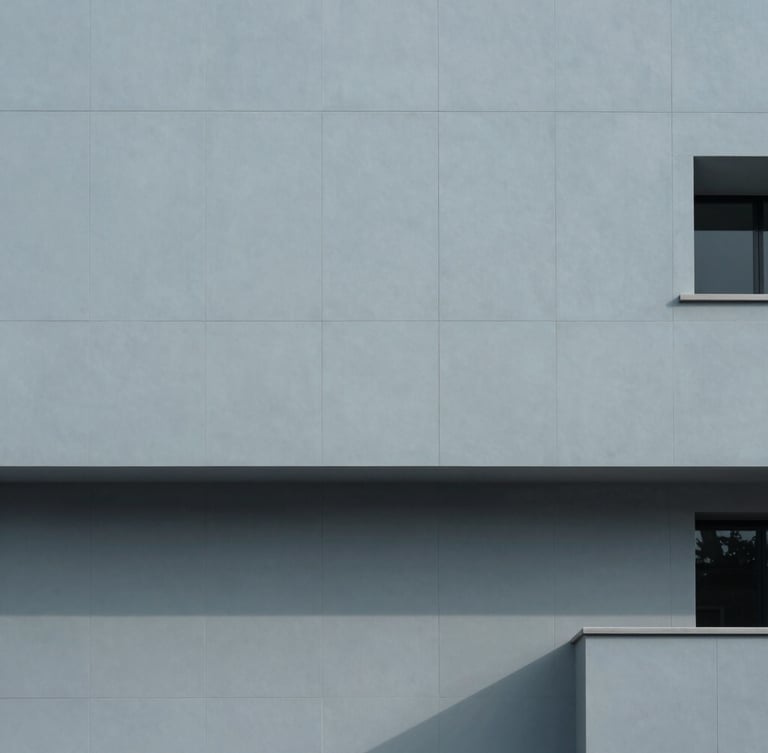 Minimalist architectural photography of a modern tech hub facade, clean geometric shadows, cool morning daylight, desaturated slate blue tones, 35mm