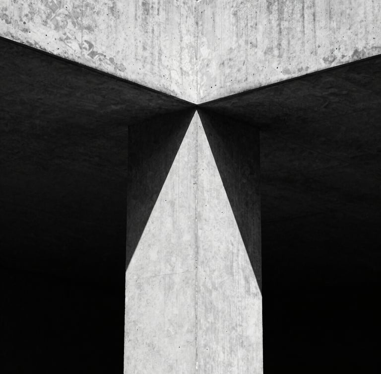 Extreme close-up of a high-contrast brutalist concrete structure with sharp geometric shadows, hard directional sunlight, desaturated black and white, 35mm film grain.
