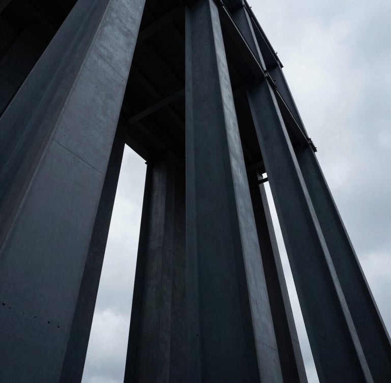Low-angle architectural photograph of massive structural steel columns rising into a dramatic overcast sky, deep slate tones