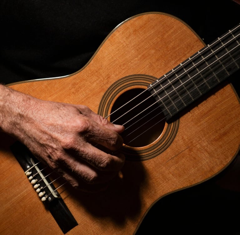 Dramatic chiaroscuro close-up of a guitarist's hand executing an alzapúa on a cypress flamenco guitar, deep shadows, warm wood tones, 35mm film grain