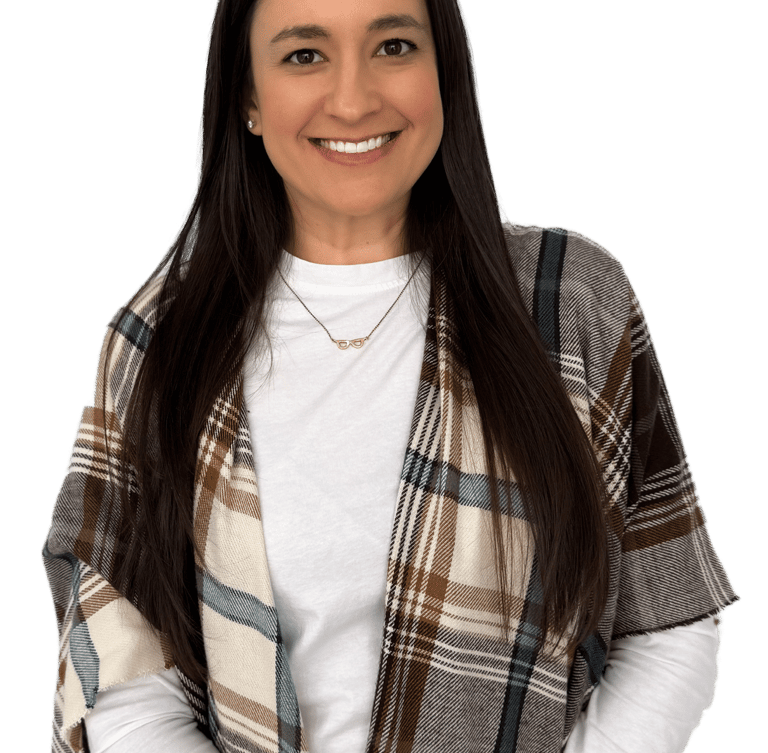 woman with long dark hair wearing a white shirt and plaid scarf