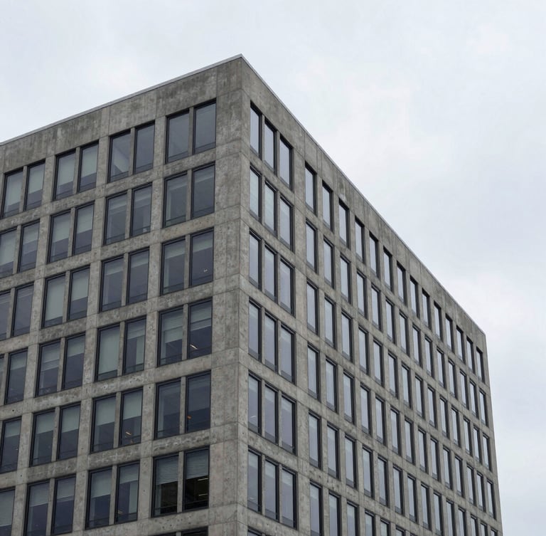 Crisp corporate photography of a modern concrete and glass office building in Ontario, cool overcast daylight, sharp architectural angles, 35mm lens.