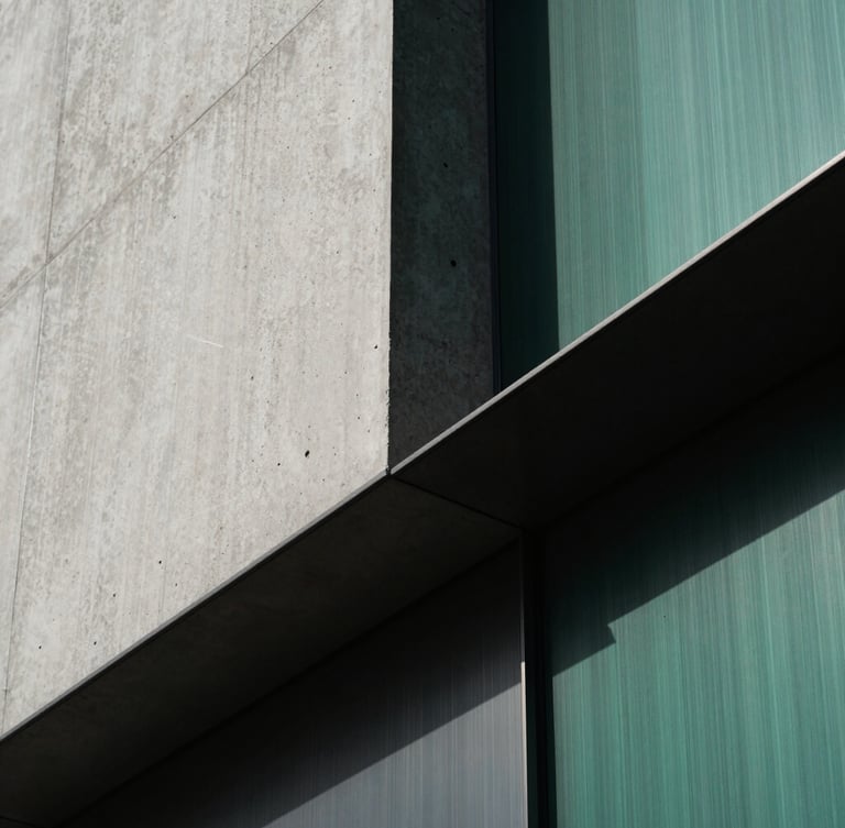 Extreme close-up detail of modern raw concrete and brushed steel architectural lines, sharp diagonal shadows, dramatic side-lighting, minimalist luxury finance aesthetic, 35mm