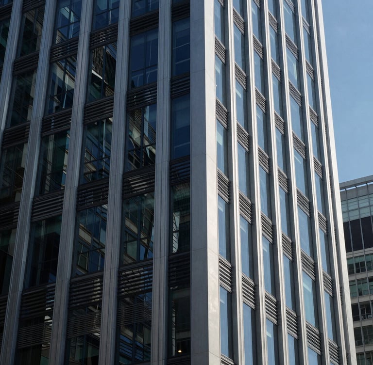 Cool corporate architecture with sharp glass and steel reflections, deep navy tones, crisp daylight, architectural angle, 35mm