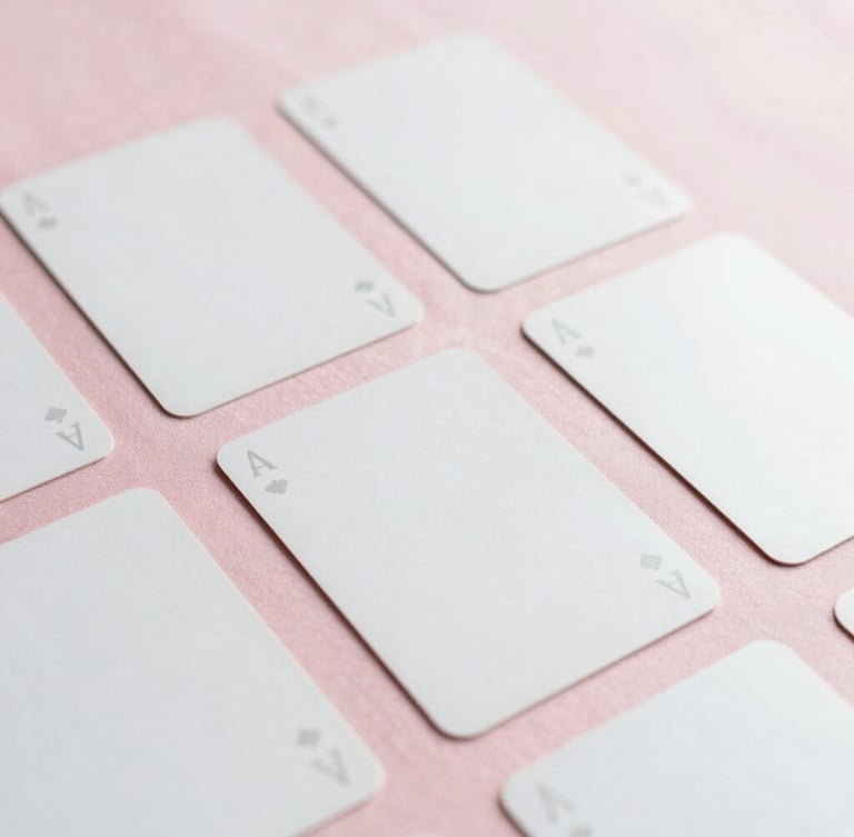 Close-up of elegant minimalist tarot cards laid out on a soft pink silk cloth, gentle morning light, clean aesthetic, negative space, 35mm fine-art photography
