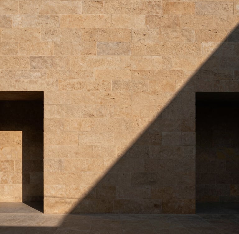 Minimalist architectural crop of a sandstone structural wall in Bhubaneswar, sharp directional sunlight, deep geometric shadows, 35mm lens