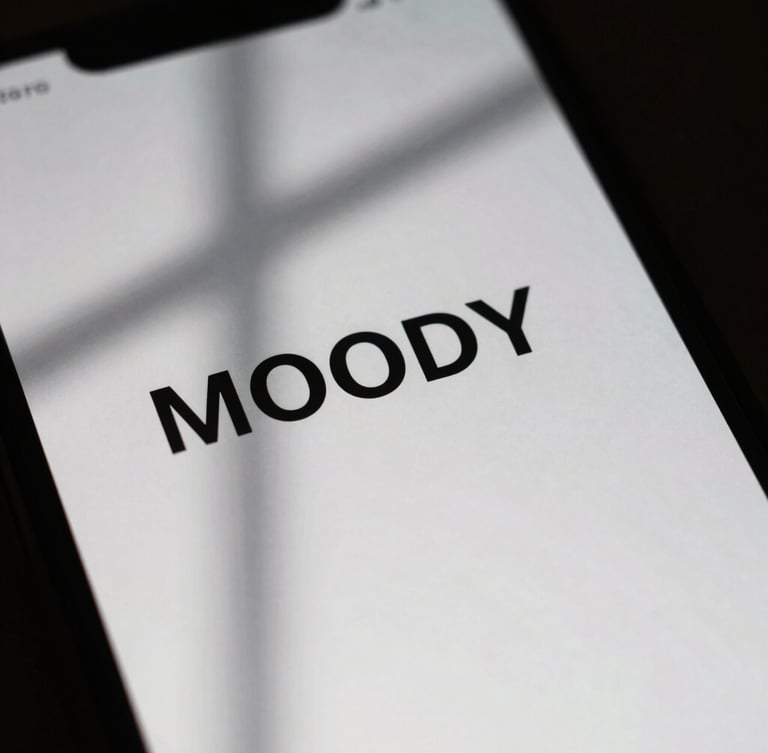 Moody close-up macro shot of a phone screen displaying a minimalist interface with high-contrast typography, soft natural window light casting deep shadows, 35mm film grain.