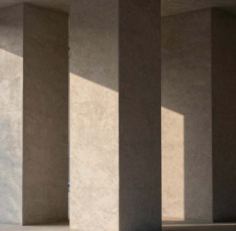 Abstract architectural composition of concrete pillars and sharp shadows, soft natural light, warm charcoal tones, minimalist editorial style
