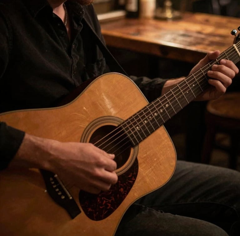Close-up of hands playing an acoustic guitar under warm stage lighting, rustic wooden table in the background, shallow depth of field, 35mm.