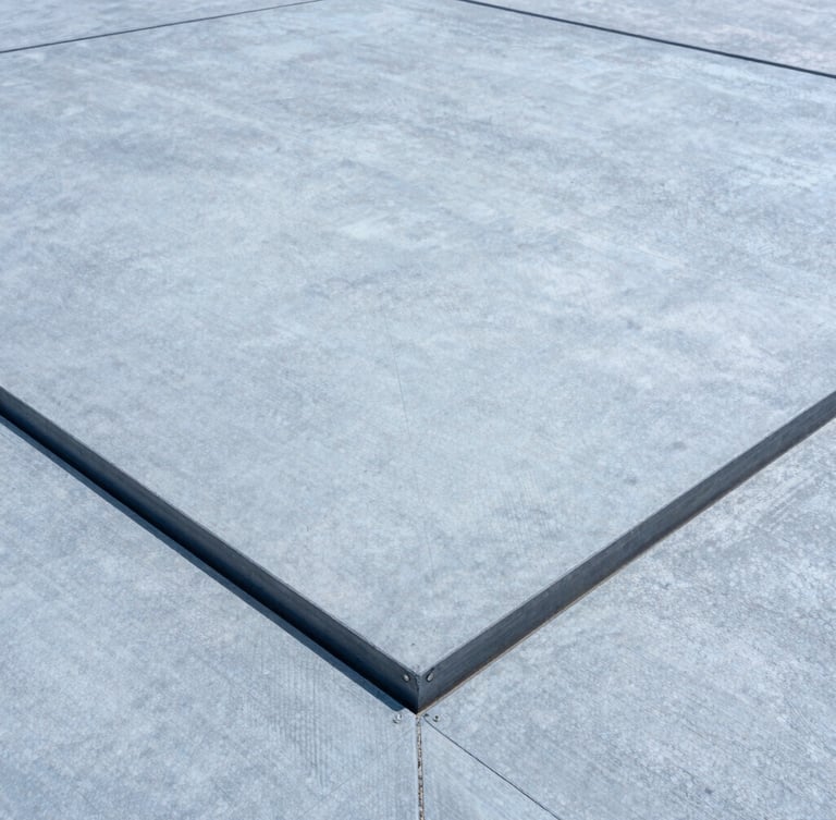 Close-up of a large expansion joint cover seamlessly integrated into a modern concrete floor, crisp daylight, cool tones, showing material texture and precise installation, wide-angle.