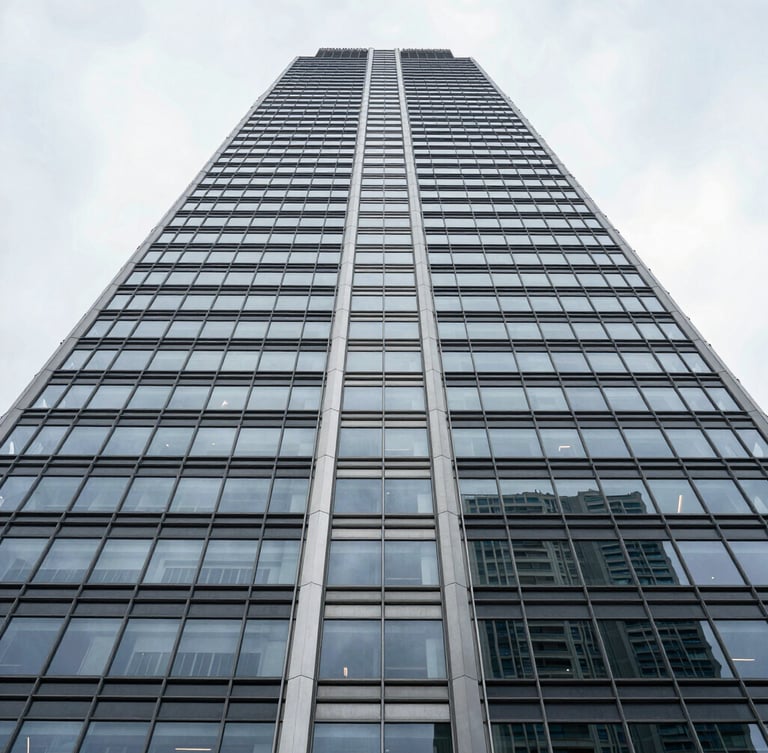 Symmetrical architectural details of a modern steel and glass skyscraper looking straight up, sharp lines, high-contrast overcast daylight.