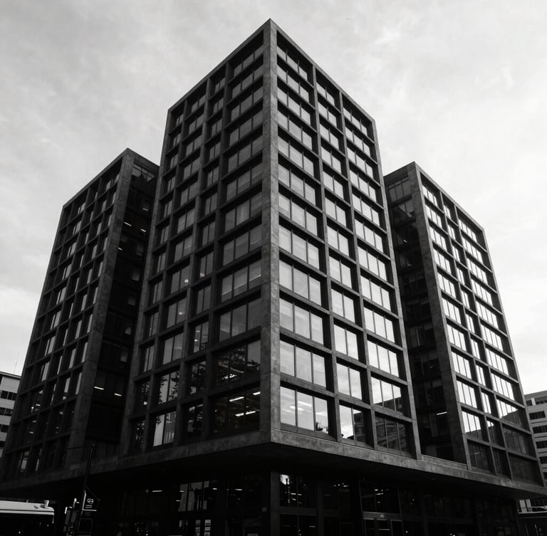 High-contrast wide-angle exterior of a modern commercial building in Albert Park, deep charcoal facade, sharp lines, reflections in glass, dramatic shadows, minimalist.