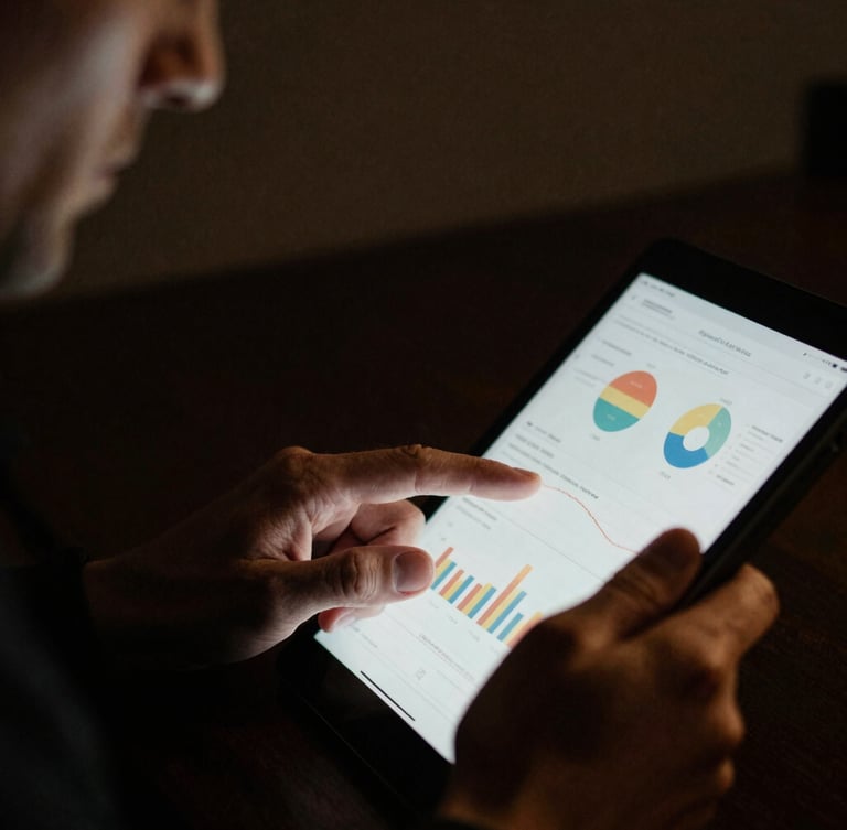 Cinematic close-up of a discerning male professional reviewing detailed analytics on a tablet, low-key lighting, deep charcoal and gold tones, high contrast, 35mm film grain, focus on hands and screen, shallow depth of field.
