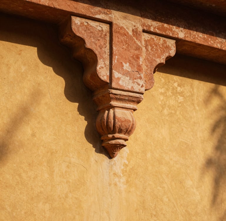 Extreme close-up of hand-carved Jaisalmer sandstone joint, golden-hour tropical sunlight casting deep geometric shadows across textured lime plaster.
