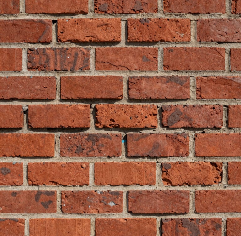 Straight-on documentary shot of a freshly struck tuckpointed brick wall, clean deep mortar joints, rough red brick texture under harsh daylight