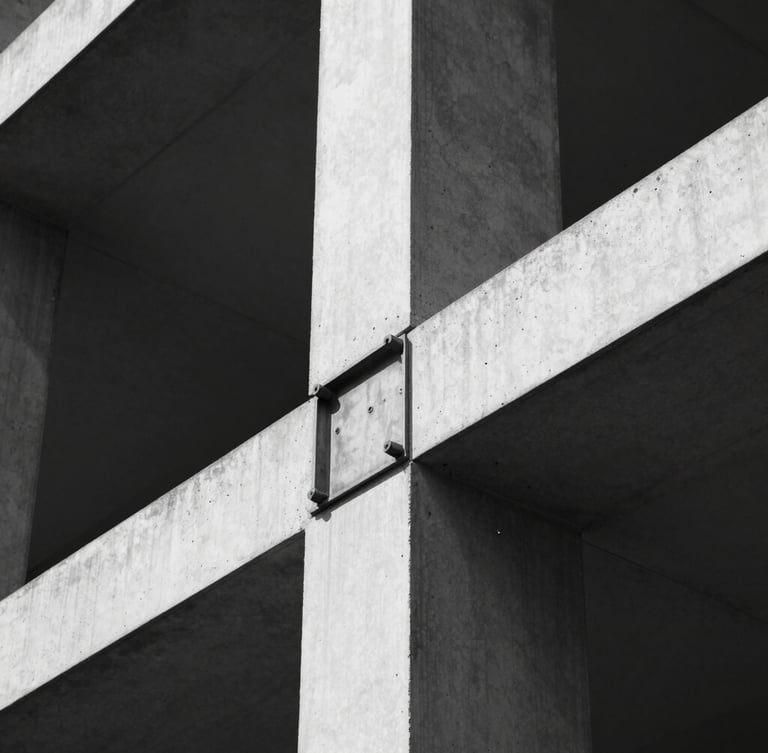 Extreme close-up of a steel joint connection in a modern building, stark natural light, high-contrast monochrome tones, sharp focus, technical architectural detail